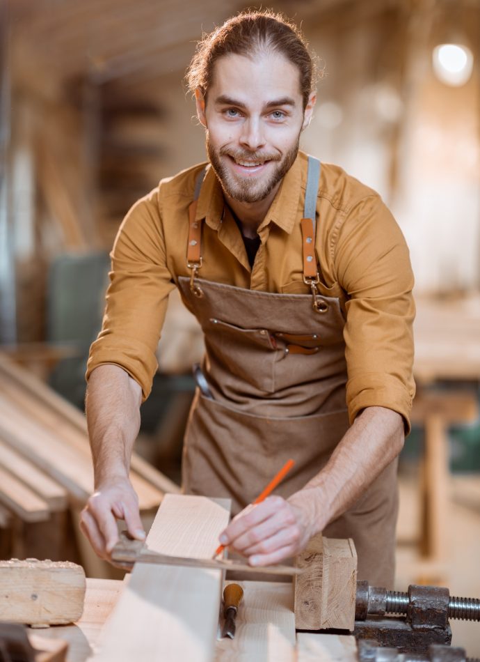 carpenter-working-with-a-wood-in-the-workshop-2